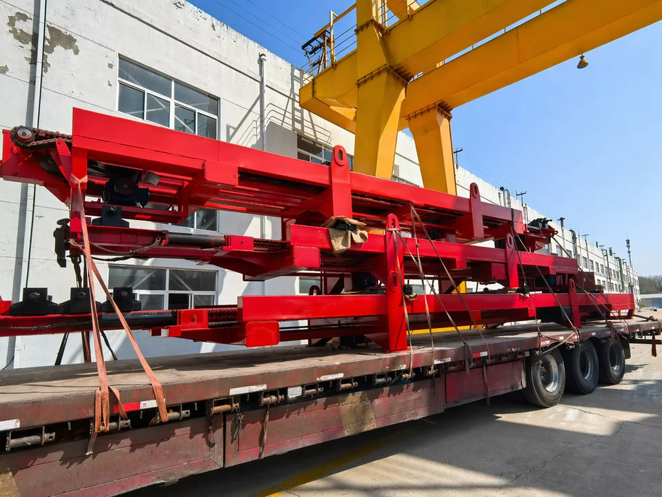 Red Qingwei equipment components secured on a transport trailer outside the workshop