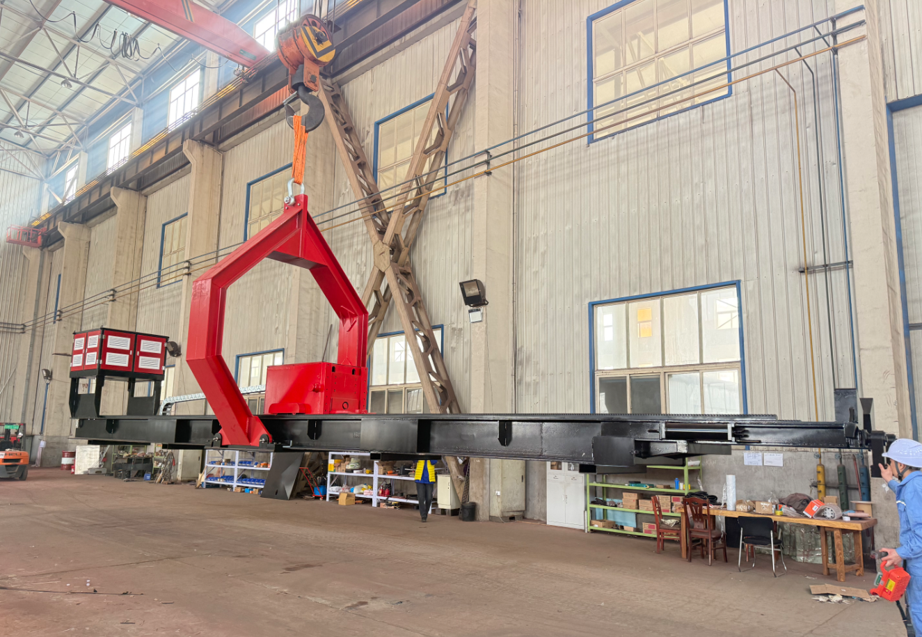 100T diesel tube bundle extractor being lifted inside a workshop